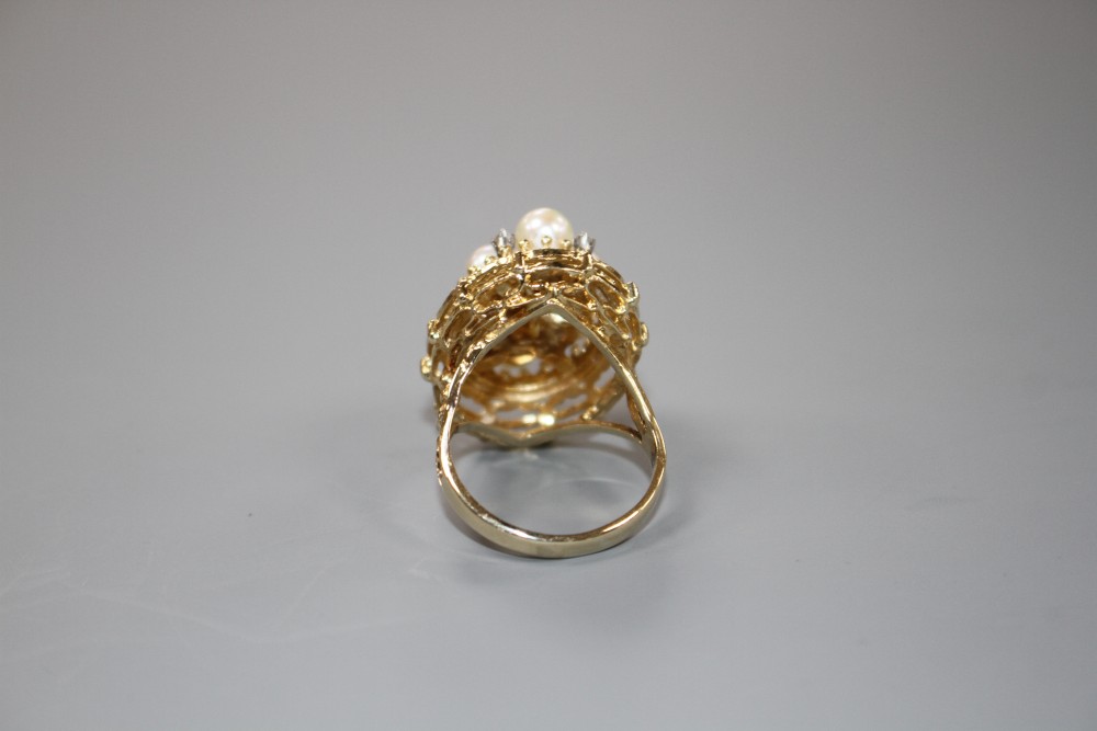 A modern 14k yellow metal, cultured pear and diamond cluster set oval dress ring, size P, gross weight 9.2 grams.